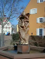 Kirchzarten im Schwarzwald, der Narrenbrunnen mit Figuren der allemanischen Fasnet wurde 1985 errichtet, M�rz 2011