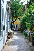 B�cker-Gang an Glockengie�erstra�e in der L�becker Innenstadt. Die G�nge und H�fe in L�beck sind ein �berrest aus dem mittelalterlichen St�dtebau. Die H�fe beruhen h�ufig auf Stiftungen wohlhabender L�becker B�rger. Aufnahme: 21. August 2021.